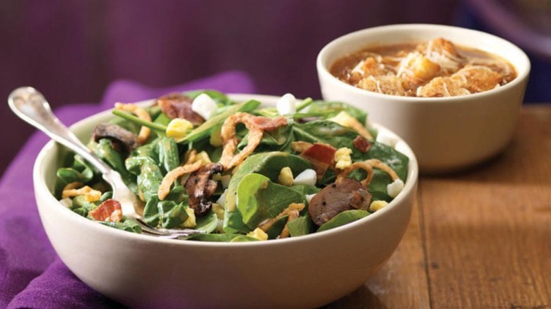 Spinach power salad and bowl of soup