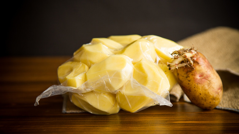 Sprouted potatoes peeled and vacuum sealed for future use