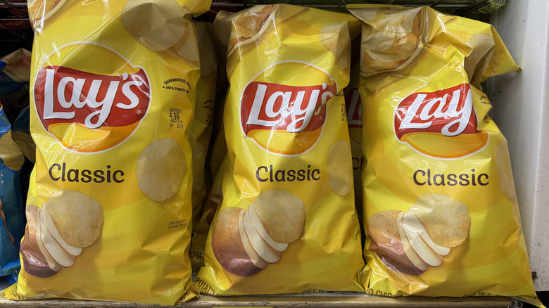 The bags of Lay's Classic potato chips on a store shelf