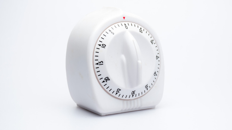white kitchen timer with white background