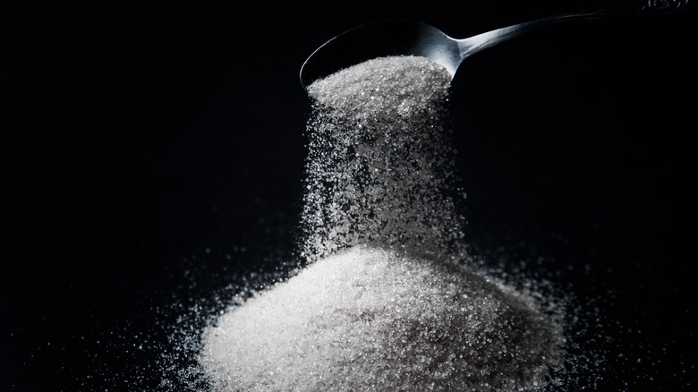 sugar being poured from spoon