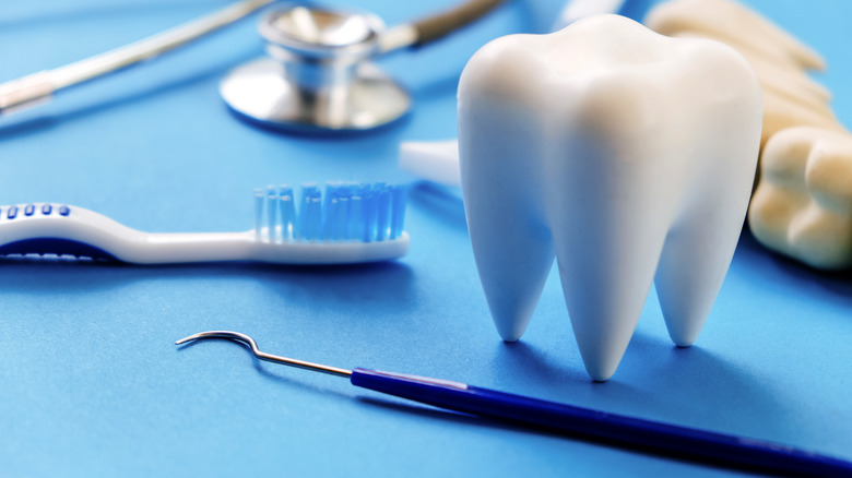 dentist's tools on blue sheet