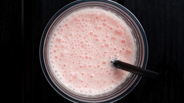Top-down view of a milkshake in a plastic takeout cup