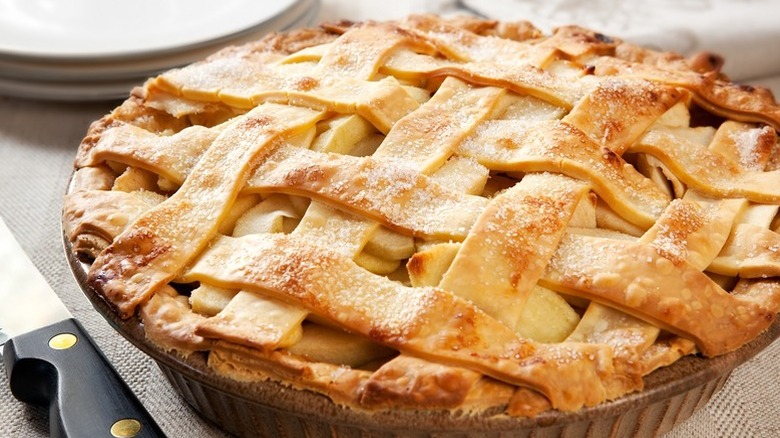 A freshly baked green chile apple pie, topped with a lattice of pastry