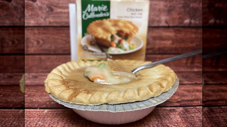 Marie Callender's chicken pot pie with the crust broken by a spoon