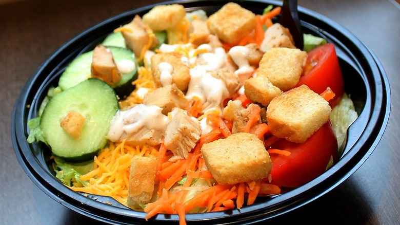Chicken salad in black bowl