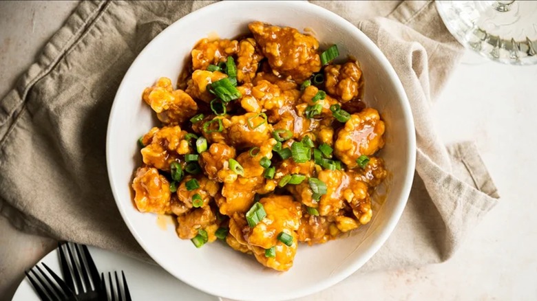 Orange chicken on white plate