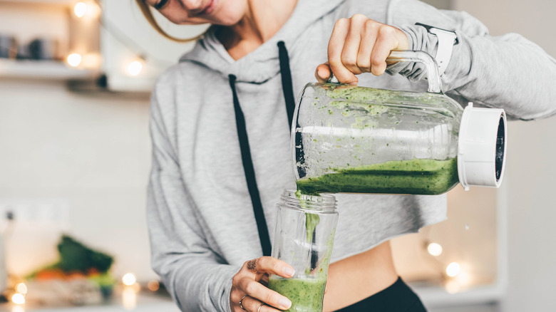 Person pouring smoothie