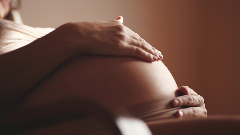 hands on pregnant belly