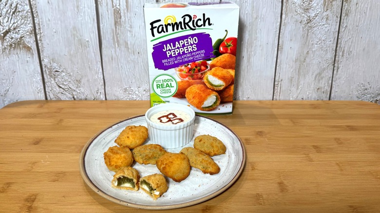 Plate of jalapeno poppers and Farm Rich box