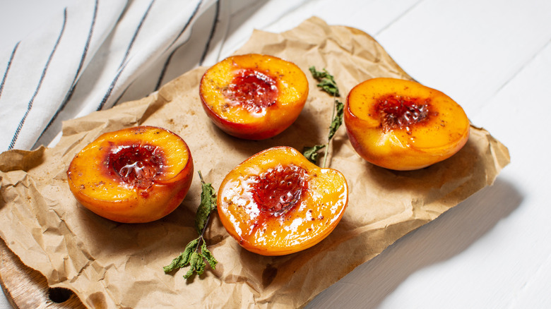 Cooked peaches on brown paper