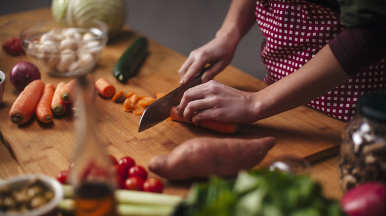 Cook cutting vegetables