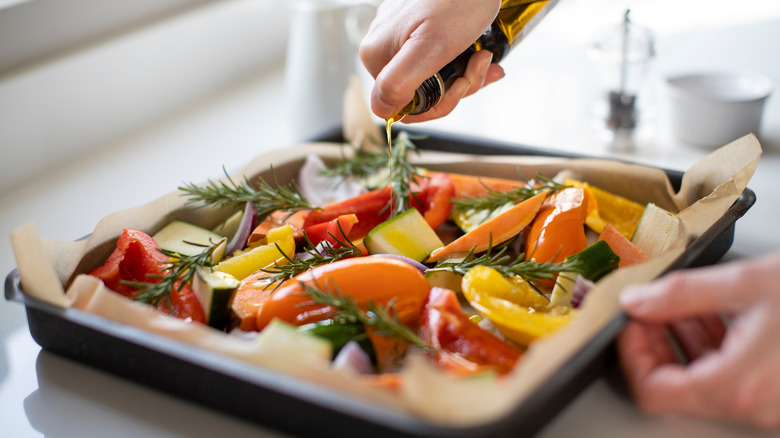 Adding oil to vegetables