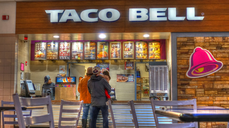 People ordering at Taco Bell counter