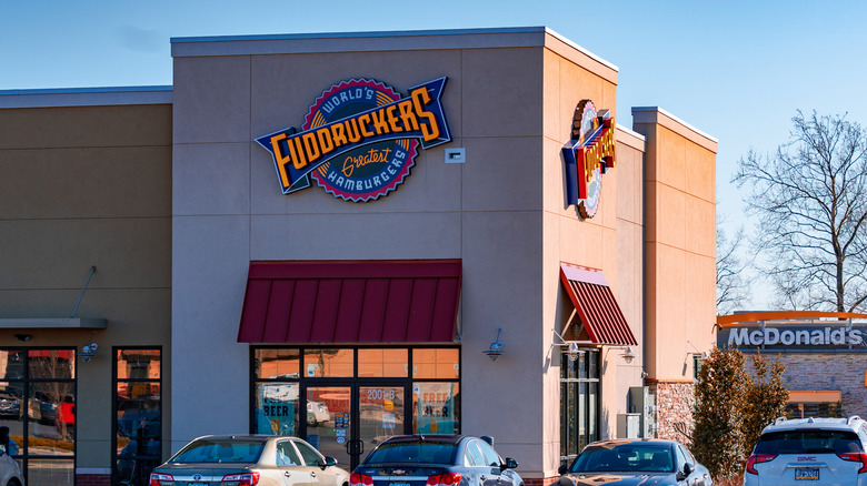 The exterior of Fuddruckers restaurant advertising world's greatest hamburgers.