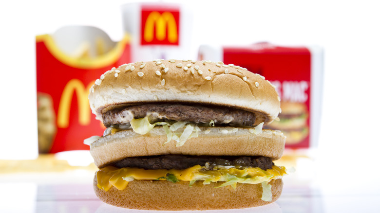 McDonald's McDouble with fries, drink, and box in the background