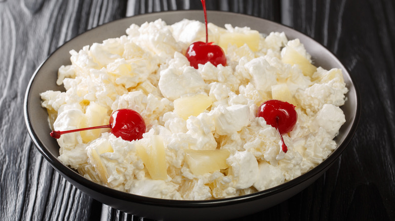 Glorified rice salad topped with cherries in a bowl