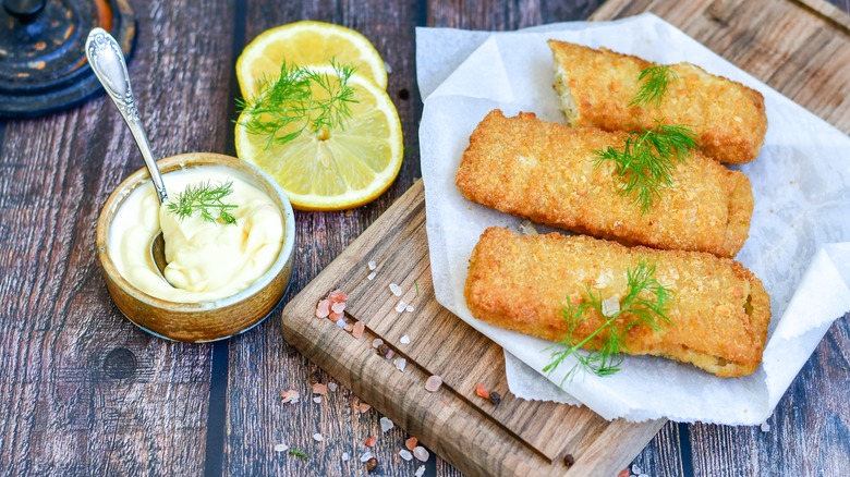 Fish sticks on wooden board