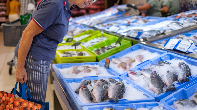 Woman shopping at fish market