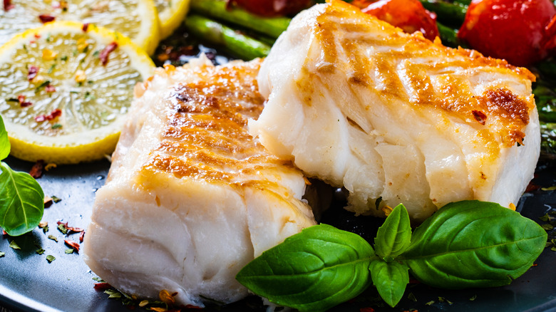 Two cod filets with garnish 