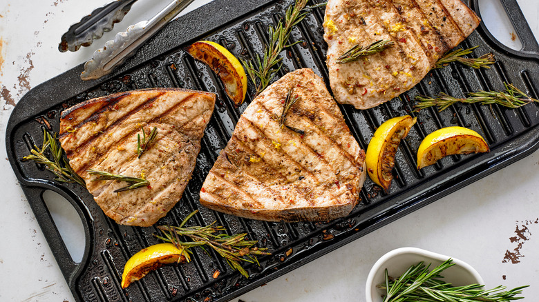 Grilled swordfish steaks on pan 