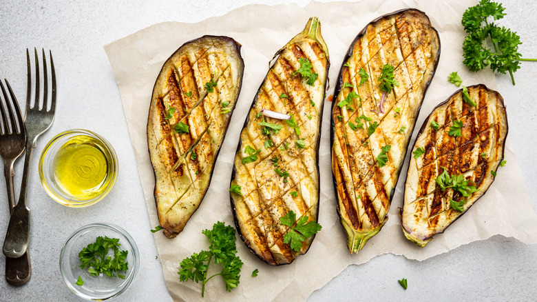 Grilled eggplant with parsley and a side of oil