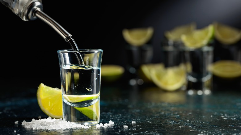 tequila poured into shot glass