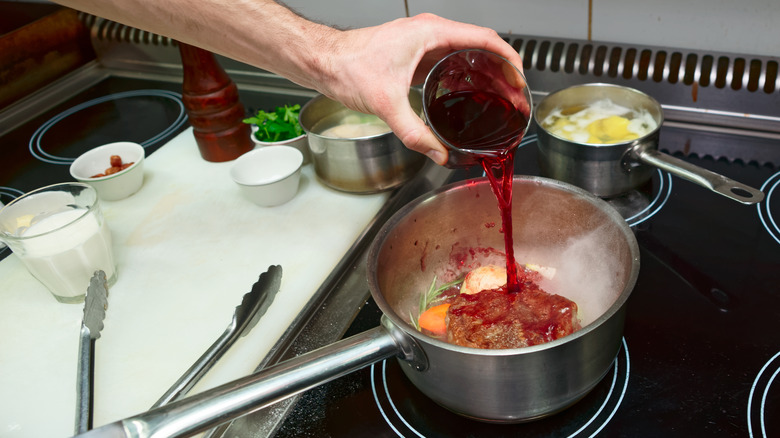Chef cooking with wine
