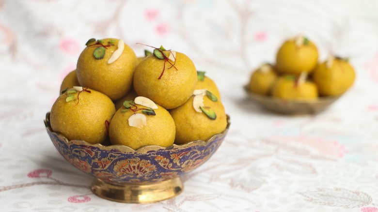 Besan ladoos in a decorative bowl