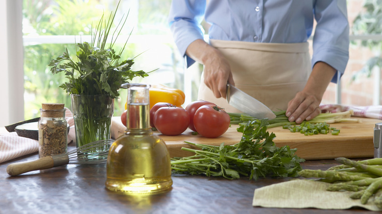 Cook chopping vegetables