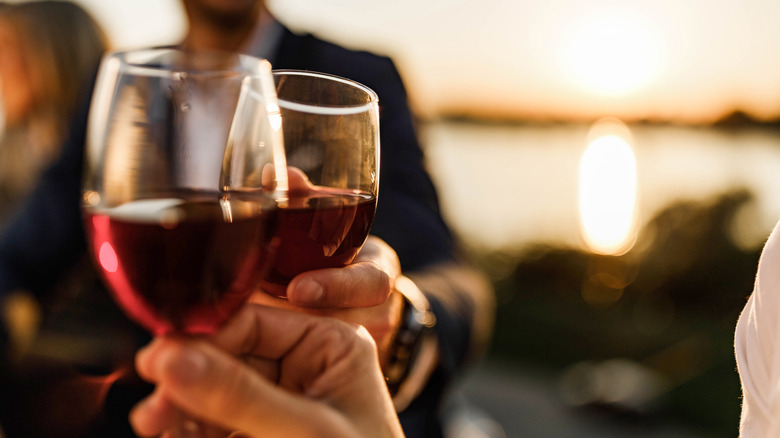friends toasting with red wine