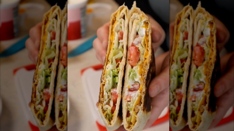 A homemade beef Crunchwrap Supreme cut open to reveal fillings