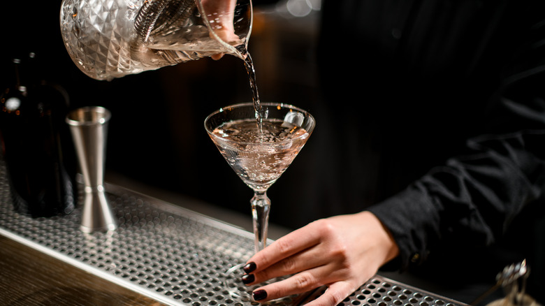 pouring martini from a shaker