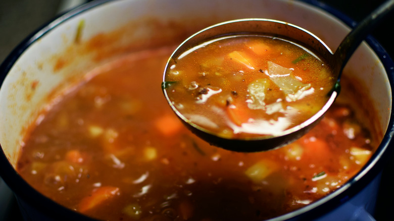 Soup in pot and ladle
