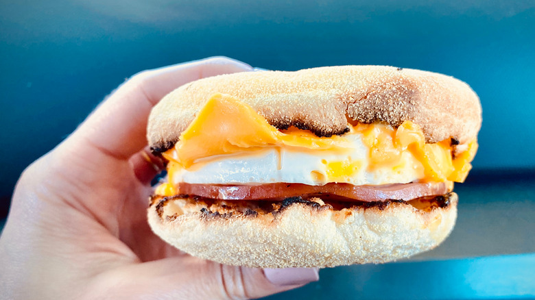 Someone holding an Egg McMuffin