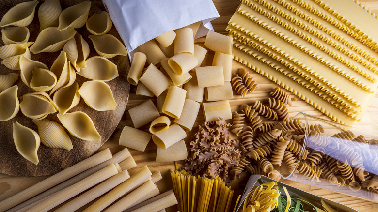 a variety of dried pasta shapes laid out together