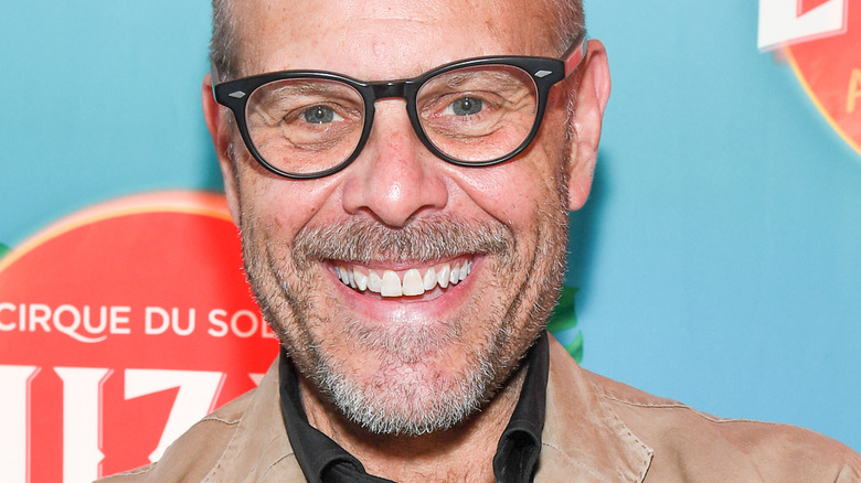 Alton Brown smiling in glasses