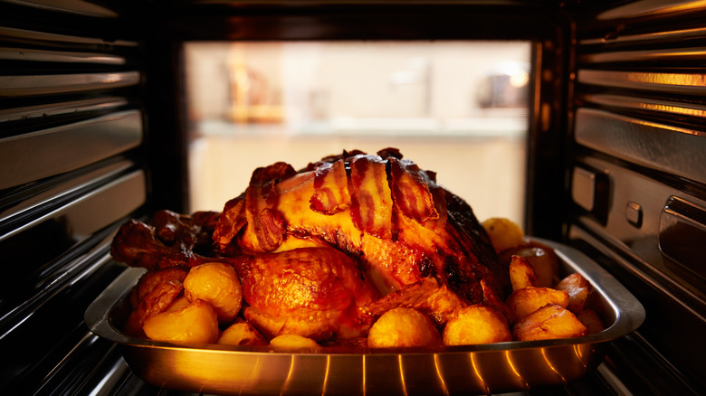 Bacon and turkey roasting in oven