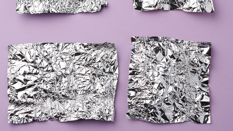 Foil pieces on purple backdrop