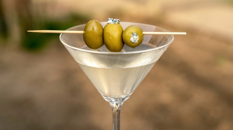 Dirty martini with three olives