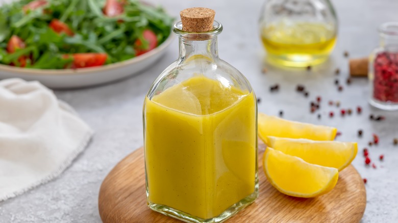 Creamy salad dressing in small bottle