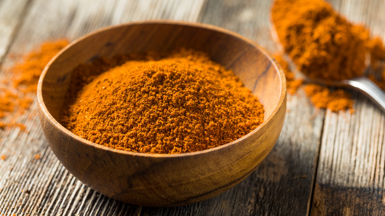 Wood bowl with spice blend and spoon