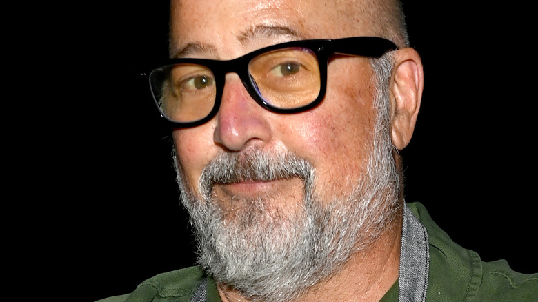 Andrew Zimmern smirking