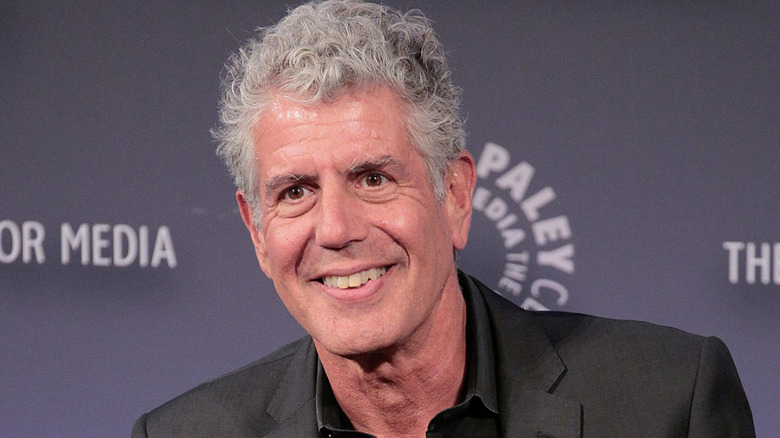 Anthony Bourdain smiling at event