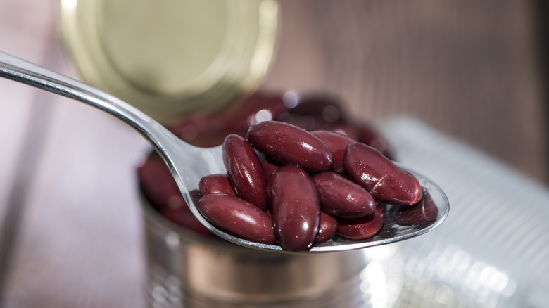 Canned black beans on spoon