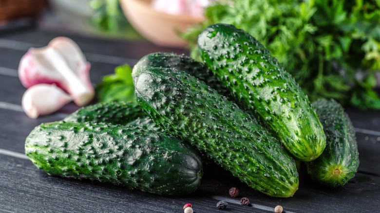 Several cucumbers on wood