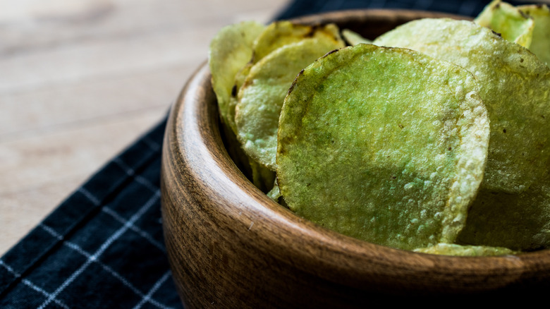 Green potato chips in a bowl