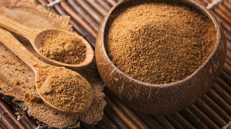 Palm sugar in a bowl with spoons