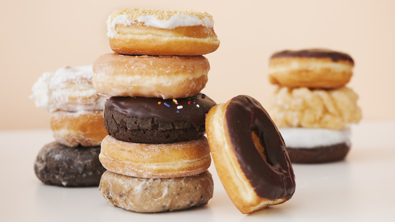 Stacks of assorted store-bought donuts