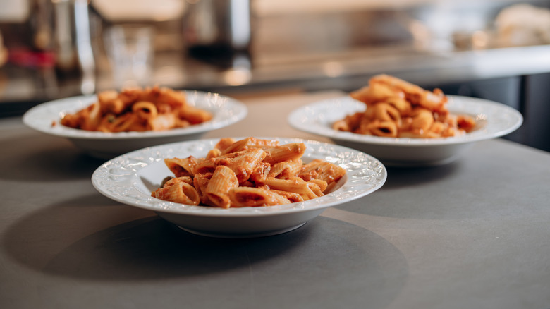 Ketchup-based pasta in bowls